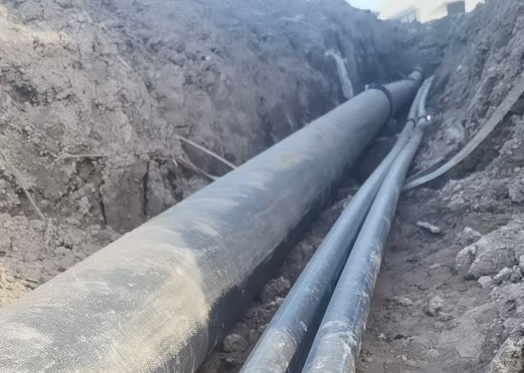MPP power conduits laid in a trench during trenchless installation MPP power conduits laid in a trench during trenchless installation